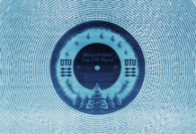 Someone made a music record so tiny, it fits inside the groove of a normal vinyl record